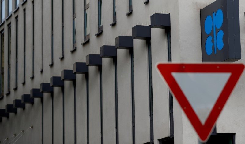 © Reuters. The OPEC logo is pictured behind a traffic sign at its headquarters in Vienna