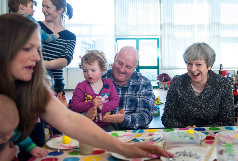 © Reuters. Britain's Prime Minister Theresa May meets a local parent and toddler group at St Andrew's Heddon-on-the-Wall, CofE Primary School in Newcastle