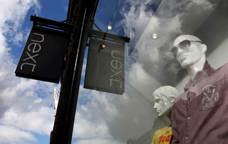 © Reuters. FILE PHOTO: Mannequins are pictured in the window of a Next clothing store in London