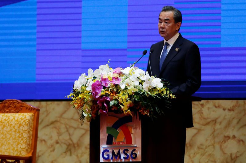 © Reuters. China's State Councillor and Foreign Minister Wang Yi speaks at a business conference as part of the Greater Mekong Subregion Summit in Hanoi