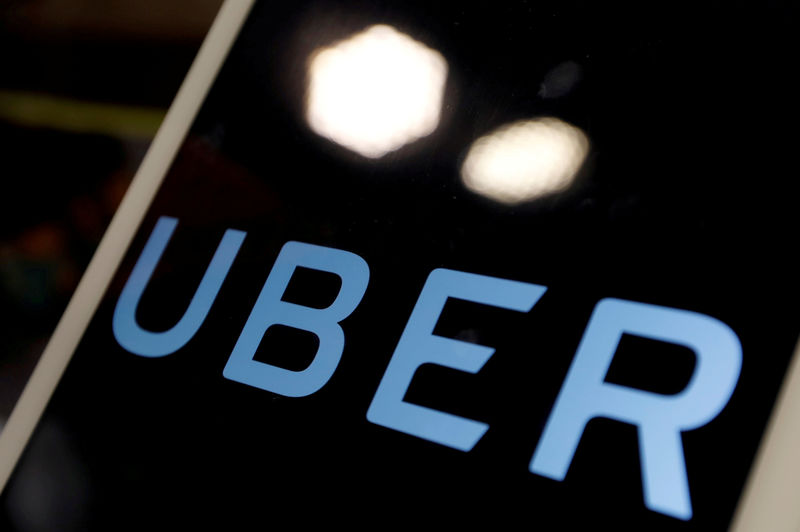 © Reuters. FILE PHOTO: The logo of Uber is seen on an iPad, during a news conference to announce Uber resumes ride-hailing service, in Taipei