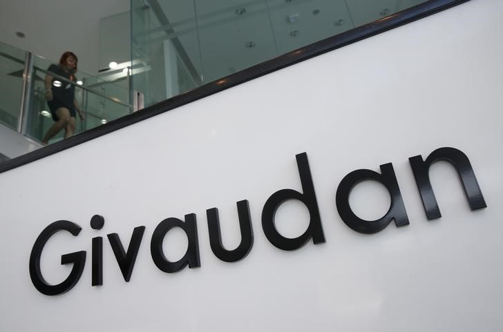 © Reuters. FILE PHOTO: An employee walks down the stairs at Givaudan's perfumery school in Singapore