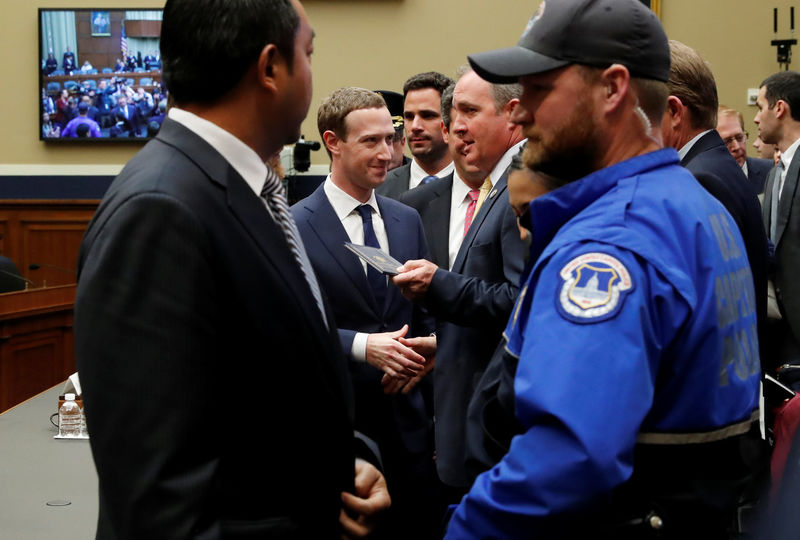 © Reuters. Facebook CEO Mark Zuckerberg finishes testifying before a House Energy and Commerce Committee hearing in Washington