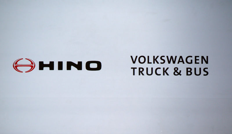 © Reuters. Logos of Hino Motors and Volkswagen Truck & Bus GmbH are displayed before their joint news conference in Tokyo