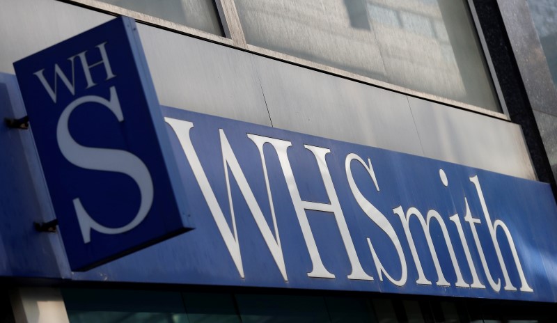 © Reuters. FILE PHOTO -  A company logo is pictured outside a branch of WH Smith in Manchester northern England.