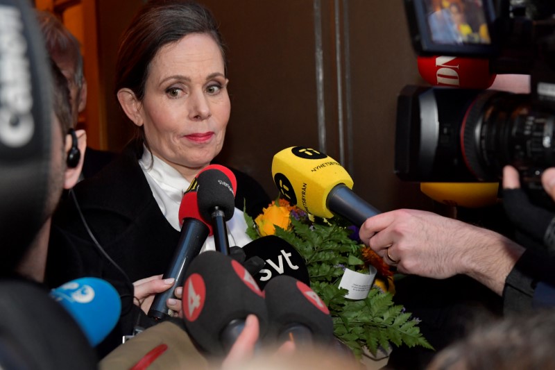 © Reuters. The Swedish Academy's Permanent Secretary Sara Danius talks to the media as she leaves after a  meeting at the Swedish Academy in Stockholm
