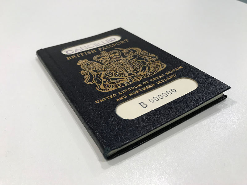 © Reuters. A handout photograph shows the original 'blue' British passport, which was subsequently replaced by the burgundy EU British passport, supplied by the UK government in London,