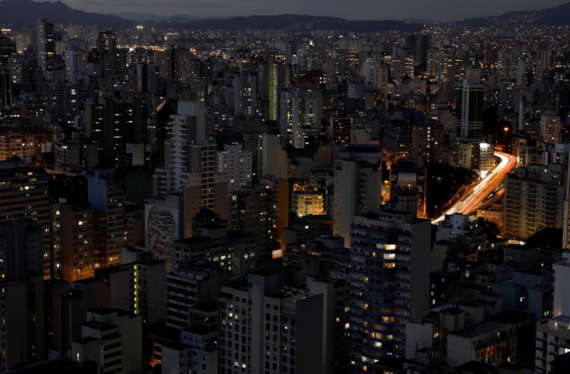 © Reuters. A general view shows buildings and cars driving down a main avenue in downtown Sao Paulo