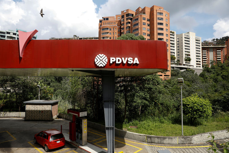 © Reuters. FILE PHOTO: The corporate logo of the state oil company PDVSA is seen at a gas station in Caracas