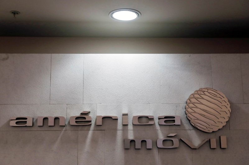 © Reuters. The logo of America Movill is seen on a wall at the company's corporate offices in Mexico City
