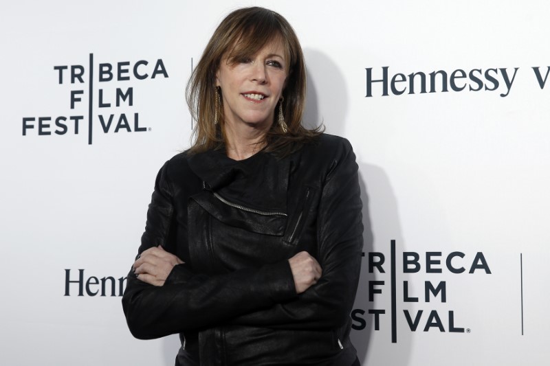 © Reuters. FILE PHOTO: Jane Rosenthal, co-founder of the Tribeca Film Festival, poses on red carpet upon arriving for the 2014 Tribeca Film Festival opening night screening of 'Time Is Illmatic' in New York