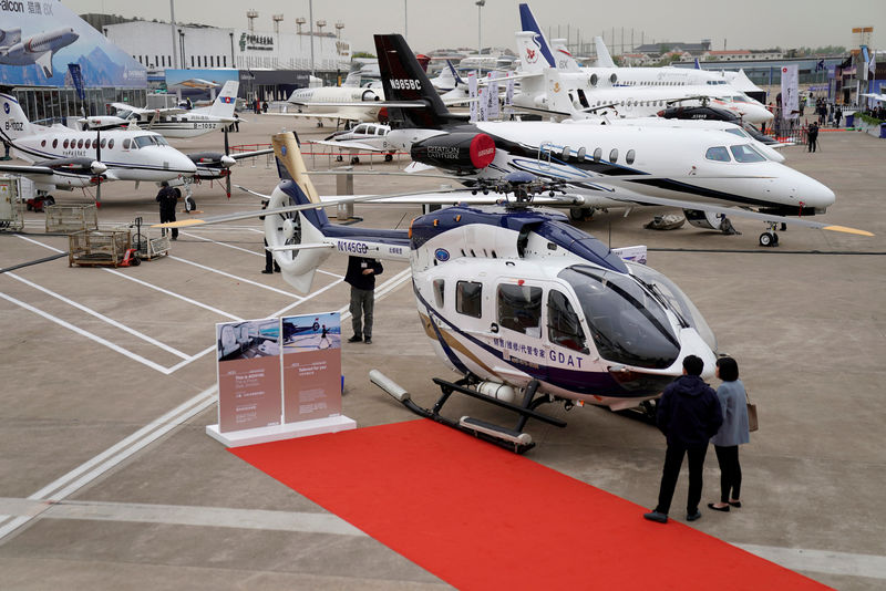 © Reuters. FILE PHOTO: People visit the Asian Business Aviation Conference and Exhibition at Hongqiao International Airport in Shanghai