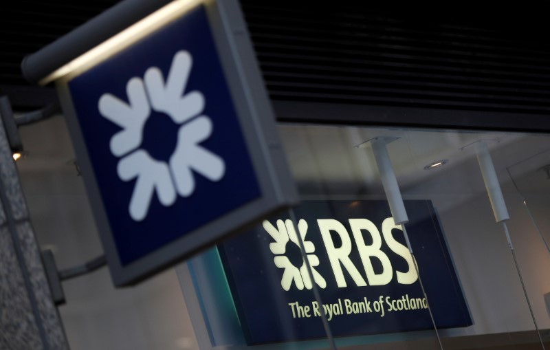 © Reuters. FILE PHOTO: Royal Bank of Scotland signs are seen at a branch of the bank, in London