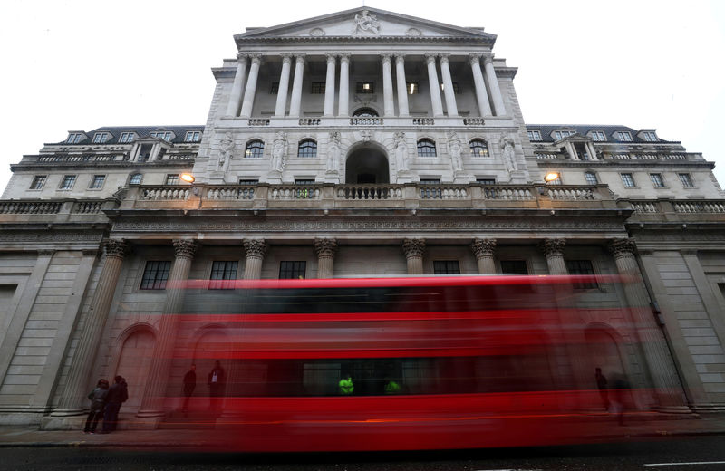 © Reuters. FILE PHOTO: A bus passes the Bank of England in London