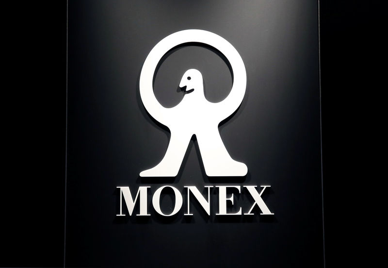 © Reuters. Logo of Monex Group Inc is seen at its headquarters in Tokyo
