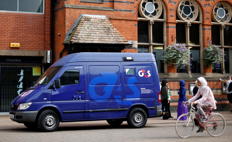 © Reuters. FILE PHOTO: A G4S security van is parked outside a bank in Loughborough