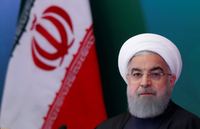 © Reuters. FILE PHOTO - Iranian President Hassan Rouhani attends a meeting with Muslim leaders and scholars in Hyderabad