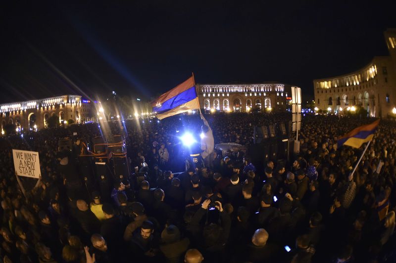 © Reuters. People protest against the appointment of ex-president Sarksyan as the new prime minister in Yerevan