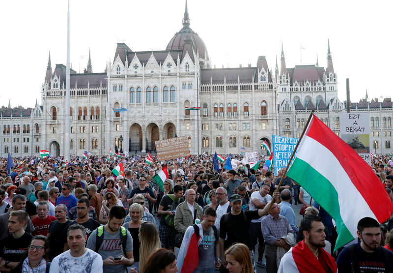 © Reuters. People attend a protest against the government of PM Orban in Budapest