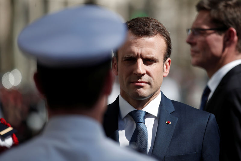 © Reuters. French President Emmanuel Macron attends a ceremony to pay tribute to Xavier Jugele one year after the French police officer was killed during a shooting incident, on the Champs Elysees avenue in Paris