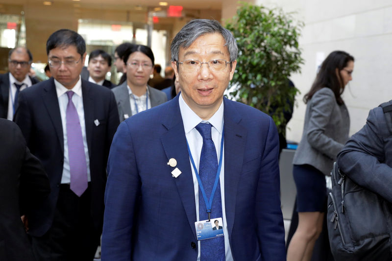 © Reuters. China's Central Bank Governor Yi Gang arrives at IMFC plenary