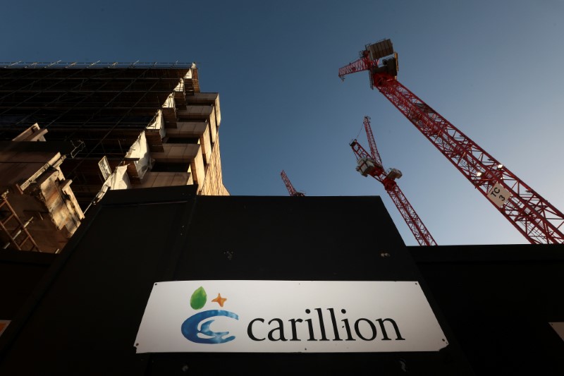 © Reuters. FILE PHOTO: A logo is seen in front of cranes standing on a Carillion construction site in central London