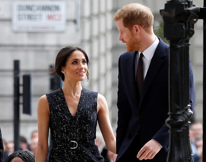 © Reuters. Britain's Prince Harry and his fiancee Meghan Markle arrive at a service at St Martin-in-The Fields to mark 25 years since Stephen Lawrence was killed in a racially motivated attack, in London
