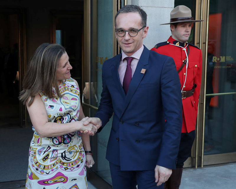 © Reuters. Canada's Minister of Foreign Affairs Freeland shakes hands with Minister of Foreign Affairs for Germany Maas prior to a reception in Toronto