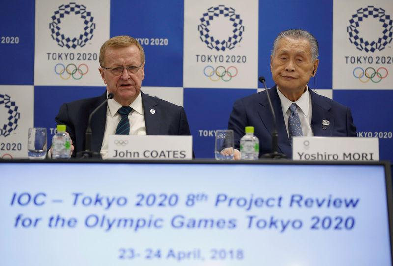 © Reuters. IOC Vice President Coates and President of Tokyo 2020 Olympic and Paralympic organising committee Mori attend their news conference following Project Review Meeting in Tokyo