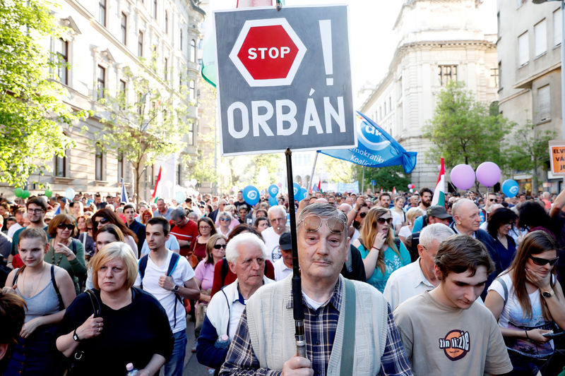 © Reuters. FILE PHOTO: People attend a protest against the government of PM Orban in Budapest