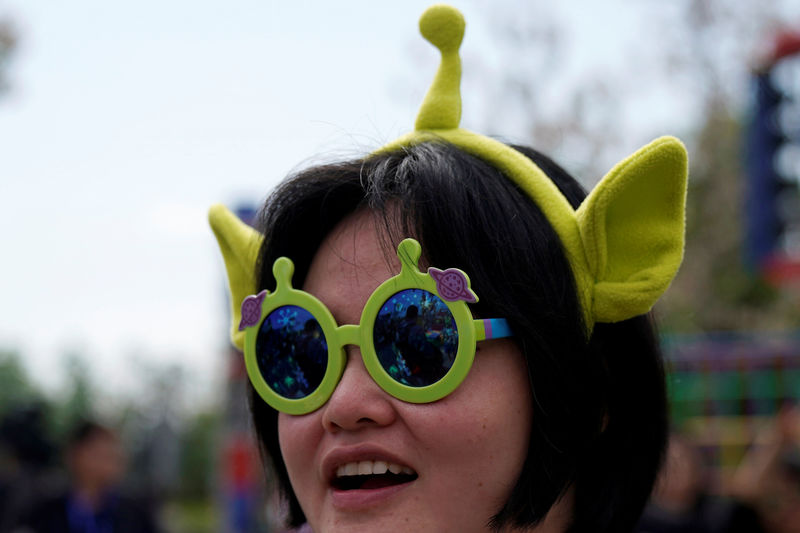 © Reuters. A woman attends the opening event of Disney-Pixar Toy Story Land, the seventh themed land at Shanghai Disneyland, in Shanghai
