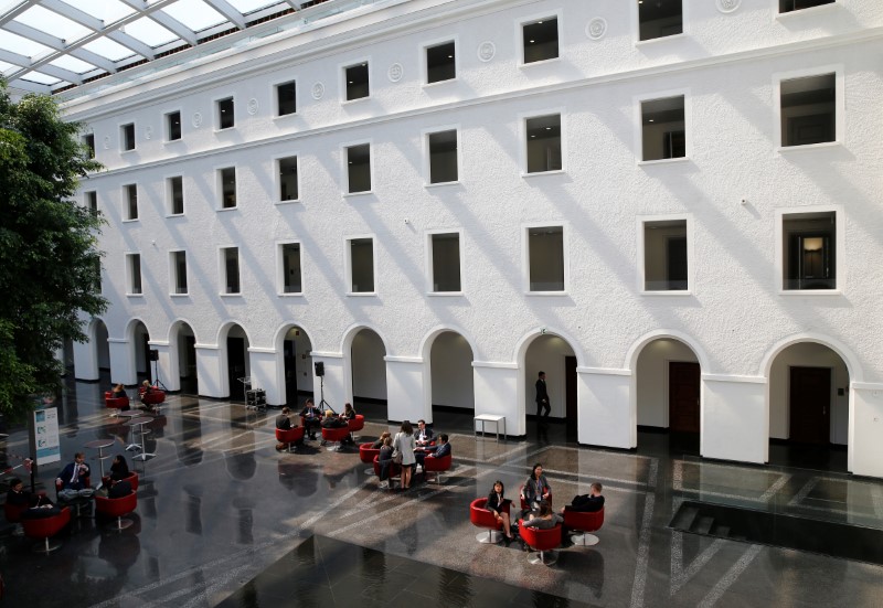 © Reuters. People are pictured in the headquarters of the WTO in Geneva