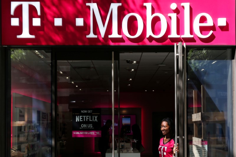 © Reuters. FILE PHOTO: A T-Mobile sign on top of a T-Mobile retail store  in New York