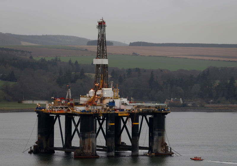 © Reuters. FILE PHOTO: A drilling rig is parked up in the Cromarty Firth near Nigg, Scotland
