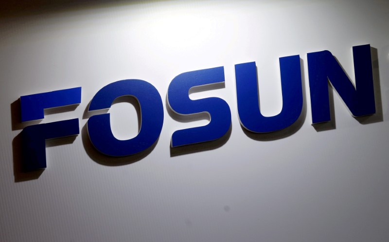 © Reuters. FILE PHOTO: Company logo of Fosun International is seen at the Fosun Fair held alongside the annual general meeting in Hong Kong
