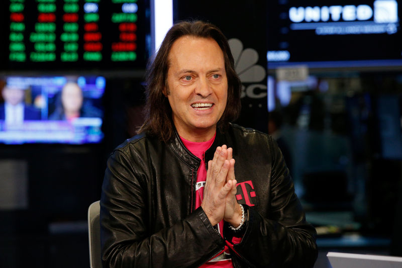 © Reuters. T-Mobile CEO John Legere speaks on the floor of the New York Stock Exchange in New York