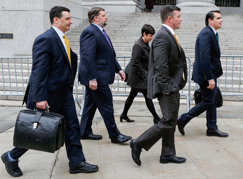 © Reuters. FILE PHOTO: Former Philidor Chief Executive Officer Davenport and ex-senior Valeant director Tanner walk on the street with their lawyers after exiting the Manhattan Federal Court in New York