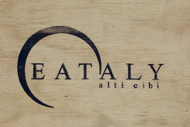 © Reuters. Eataly logo is pictured on a wood box at the Eataly food market store entrance in the former Smeraldo teather downtown Milan