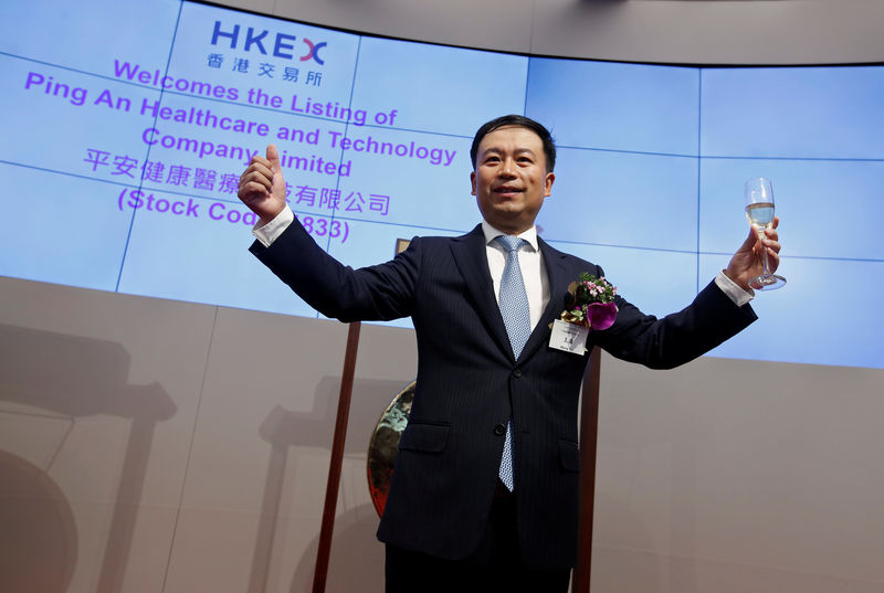 © Reuters. Ping An Healthcare and Technology Co Ltd Chairman and CEO Wang Tao poses during the listing of the company in Hong Kong
