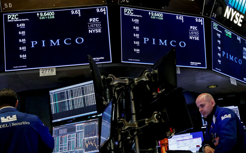 © Reuters. Ticker and trading information for PIMCO are displayed on a screen at NYSE in New York