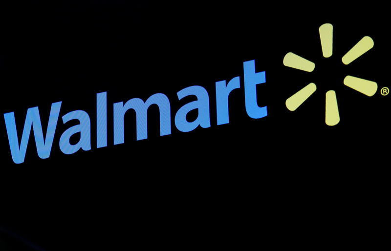 © Reuters. The Walmart logo is displayed on a screen on the floor of the NYSE in New York