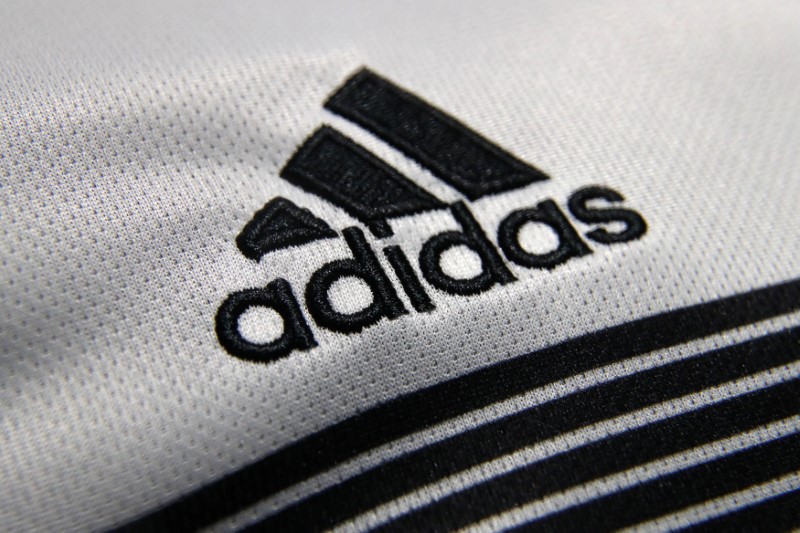 © Reuters. FILE PHOTO: An Adidas sign is seen before the company's annual news conference in Herzogenaurach