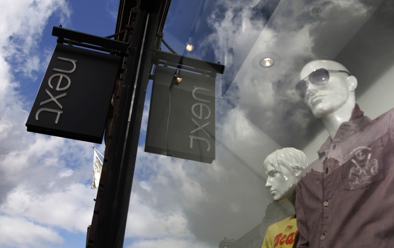 © Reuters. Mannequins are pictured in the window of a Next clothing store in London