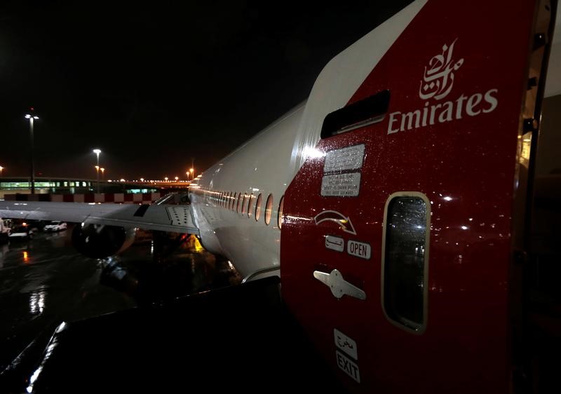 © Reuters. The Emirates airlines logo is seen on the back door of a plane at Dubai International Airport