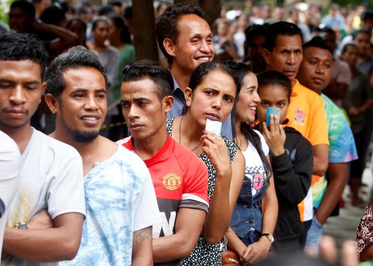 © Reuters. الناخبون في تيمور الشرقية يصوتون لإنهاء مأزق سياسي في البرلمان