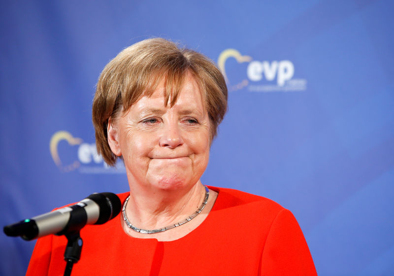 © Reuters. German Chancellor Angela Merkel (CSU) reacts at the EPP (European Parliament Presidents) meeting in Munich