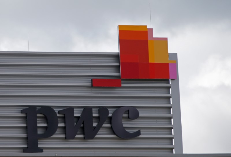 © Reuters. FILE PHOTO: The logo of PwC is seen on the local offices building of the company in Luxembourg