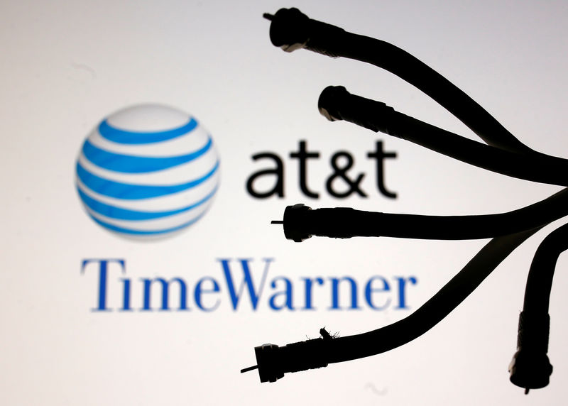 © Reuters. Coaxial TV Cables are seen in front of AT&T and Time Warner logos in this picture illustration