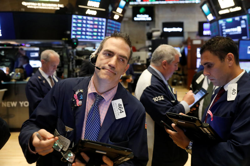 © Reuters. Traders work on the floor of the New York Stock Exchange shortly after the opening bell in New York