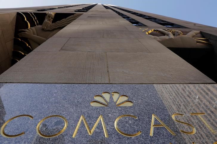 © Reuters. The NBC and Comcast logos are displayed on 30 Rockefeller Plaza in midtown Manhattan in New York